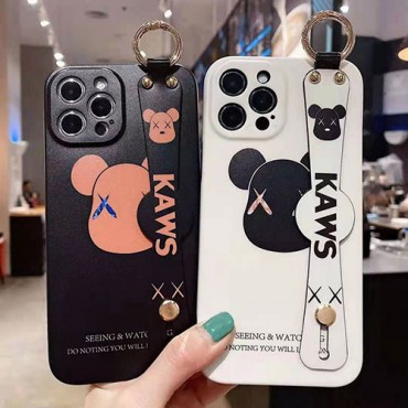 カウズ ブランド iphone12/12 pro/12 pro maxケース ハンドバンド付き 韓国風 ホルダー付 KAWS 個性潮 iphone x/xr/xs/xs maxケース 落下防止 ファッション ins風 iphone 11/1