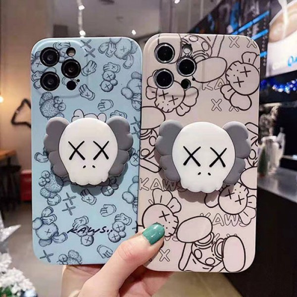 カウズ ブランドiphone12/12pro max/12 mini/12 pro maxケース ハンドバンド付き 韓国風 ホルダー付 KAWS 個性潮 iphone x/xr/xs/xs maxケース 落下防止 ファッション ins風 i