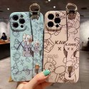 カウズ ブランドiphone12/12pro max/12 mini/12 pro maxケース ハンドバンド付き 韓国風 ホルダー付 KAWS 個性潮 iphone x/xr/xs/xs maxケース 落下防止 ファッション ins風 i